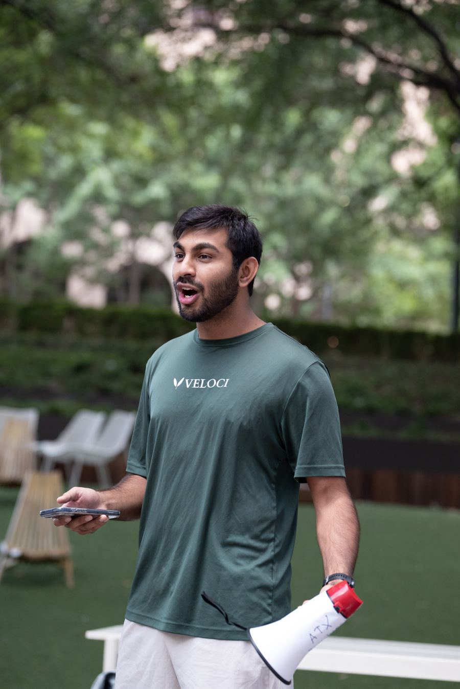 Ayush, founder of ATX Run Tours, talking to the group with a megaphone in hand