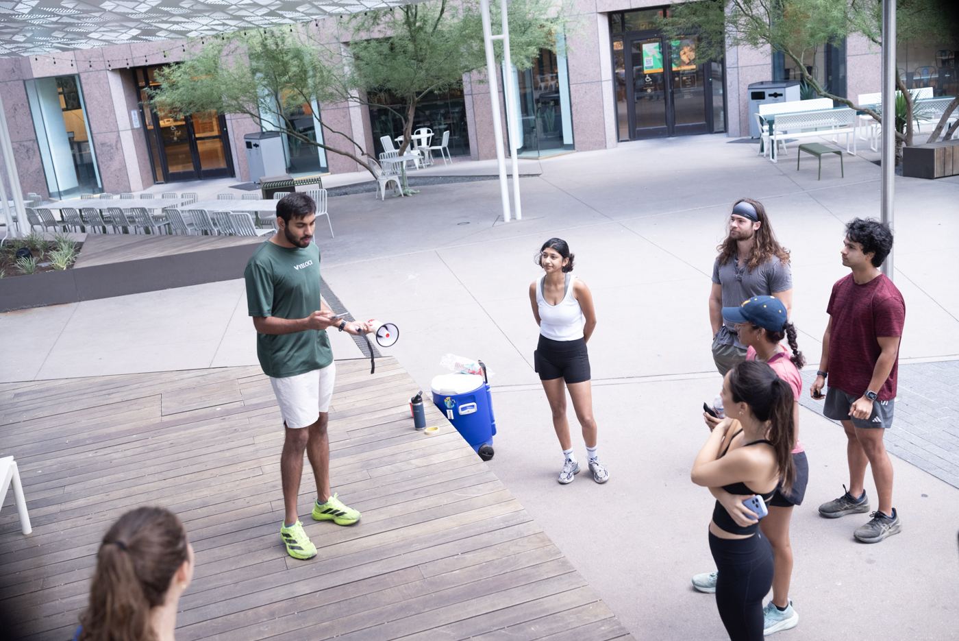 The guide briefing the group on the plaza before the run